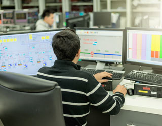 Person sitting by a desk