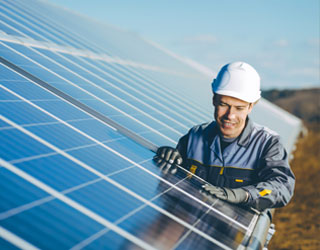 Person looking at solar panel