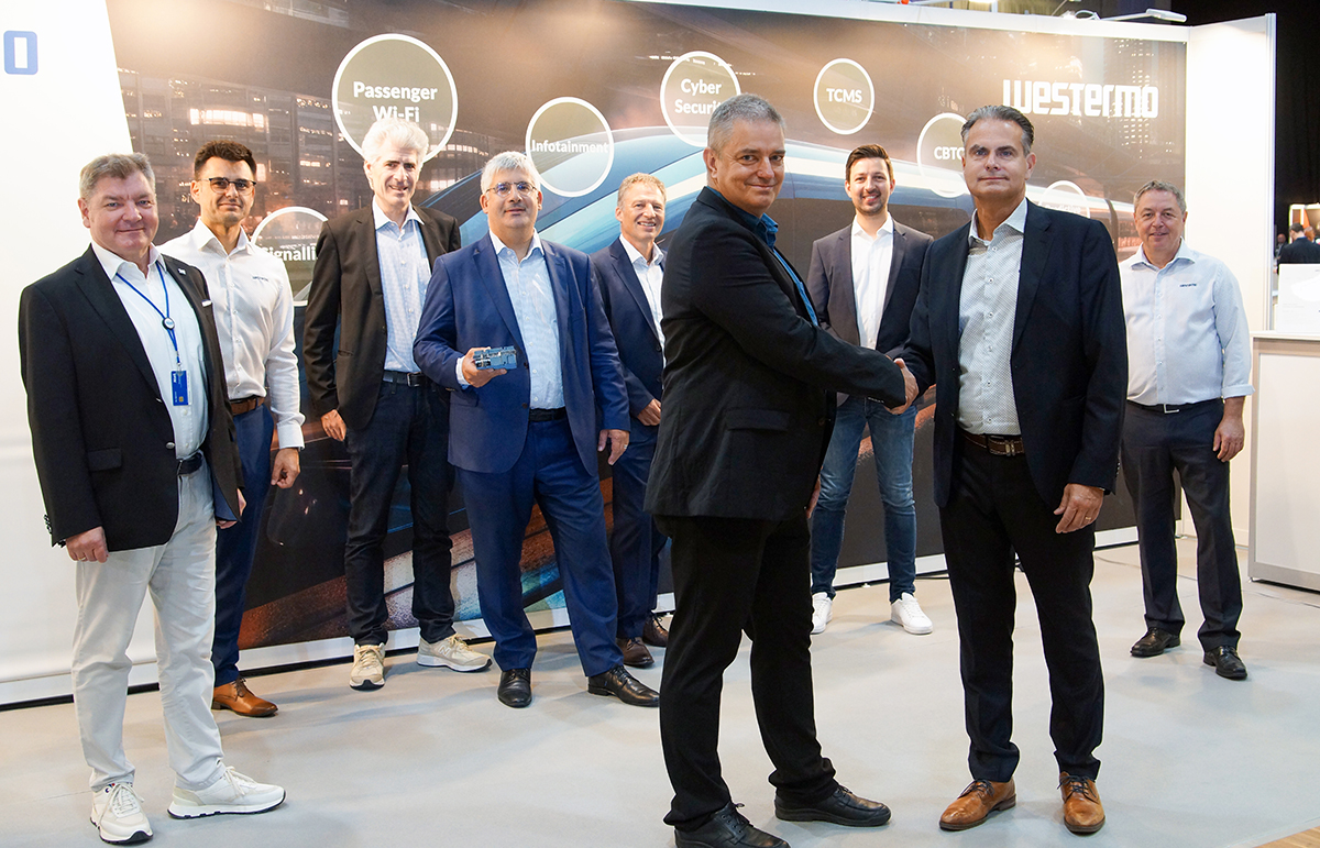 Announcing the partnership between Westermo and Eviden at the 8th Railway Forum conference in Berlin, Thomas Riechmann, Eviden Vice President and COO Cybersecurity Services shakes hands with Mikael Jidenius, Westermo Global Market Director - Trackside Networks.