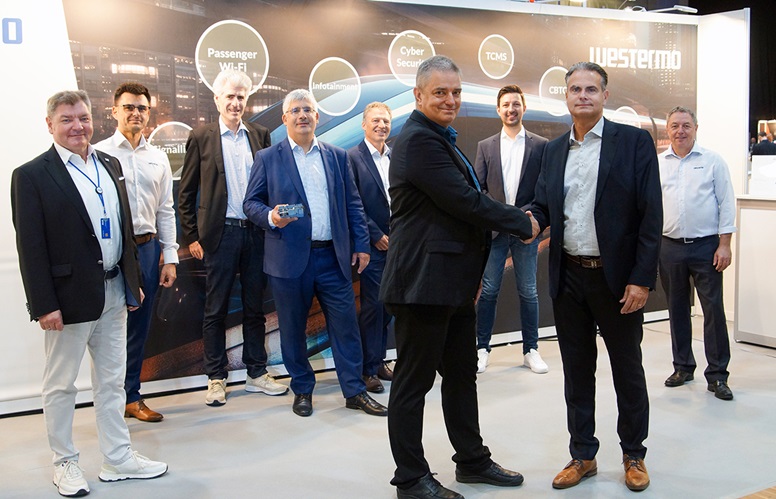Announcing the partnership between Westermo and Eviden at the 8th Railway Forum conference in Berlin, Thomas Riechmann, Eviden Vice President and COO Cybersecurity Services shakes hands with Mikael Jidenius, Westermo Global Market Director - Trackside Networks.