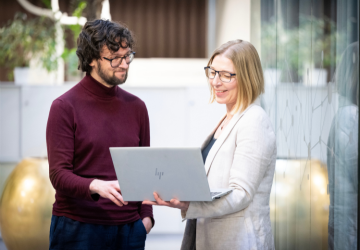 Two engineers with a laptop.