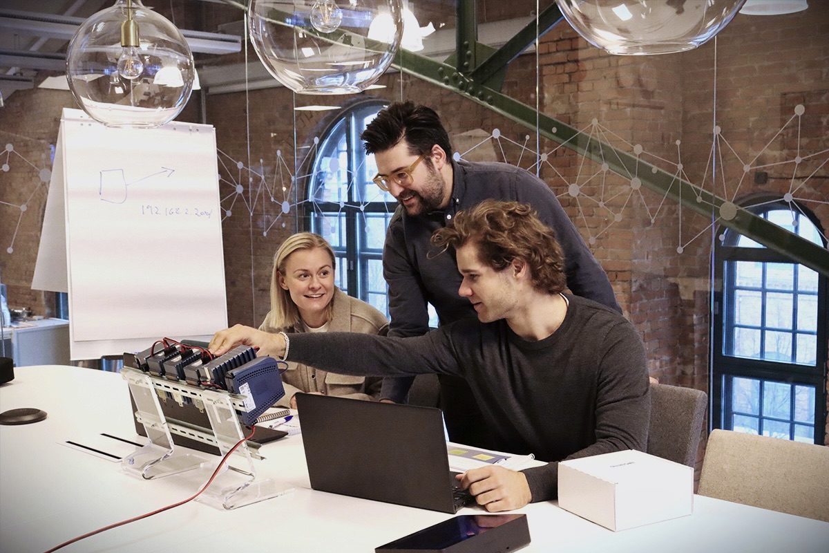 image of two students and their teacher in a course at Westermo