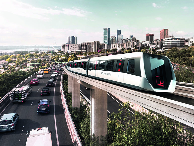 Max Bögl TSB levitation train in front of city lanscape.