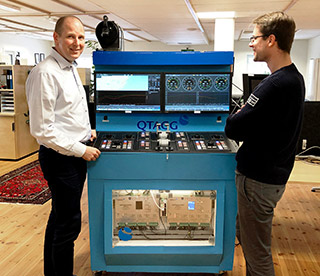 Qtagg CEO Tomas Lindqvist and Design Engineer Niclas Rasmusson next to Qtagg test rig.