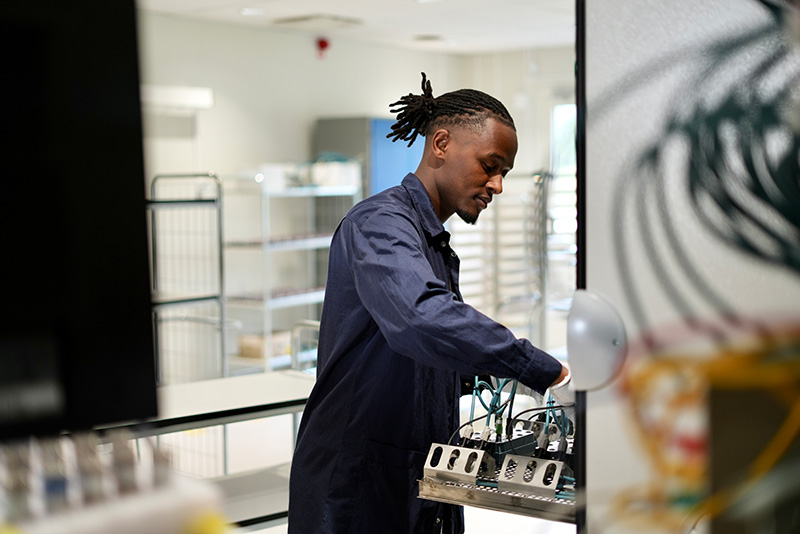 A man working in the factory with product heat testing. 
